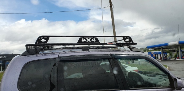 Багажник ВАЗ-2123 Chevolet Niva с боковым ограждением с сеткой на рейлинги Уникар V212302